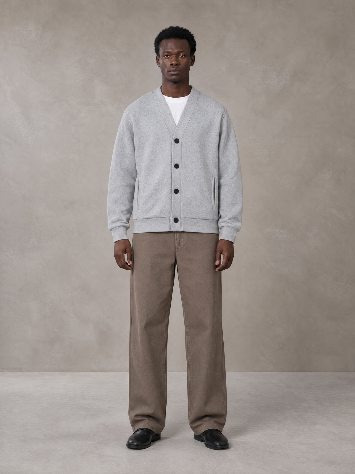 Model wearing SM Sig. Cardigan in Floral Grey, front view.