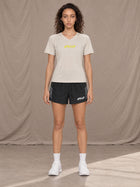 Model wearing SM Motion Stride Shorts in Midnight Black, front view.