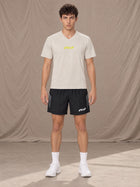 Model wearing SM Motion Stride Shorts in Midnight Black, front view.