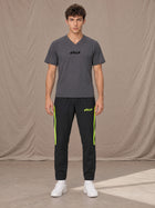 Model wearing SM Motion Stripe Track Trousers in Midnight Black, front view.