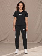 Model wearing SM Motion Stripe Track Trousers in Midnight Black, front view.