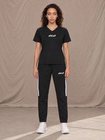 Model wearing SM Motion Stripe Track Trousers in Midnight Black, front view.