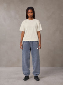 Model wearing SM Sig. Jogger Sweatpants in Washed Blue Jean, front view.