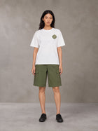 Model wearing SM Verdant Fleur T-shirt in Lucent White, front view.