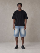 Model wearing SM Heritage Vintage Wash Denim Shorts in Cadet Grey, front view.
