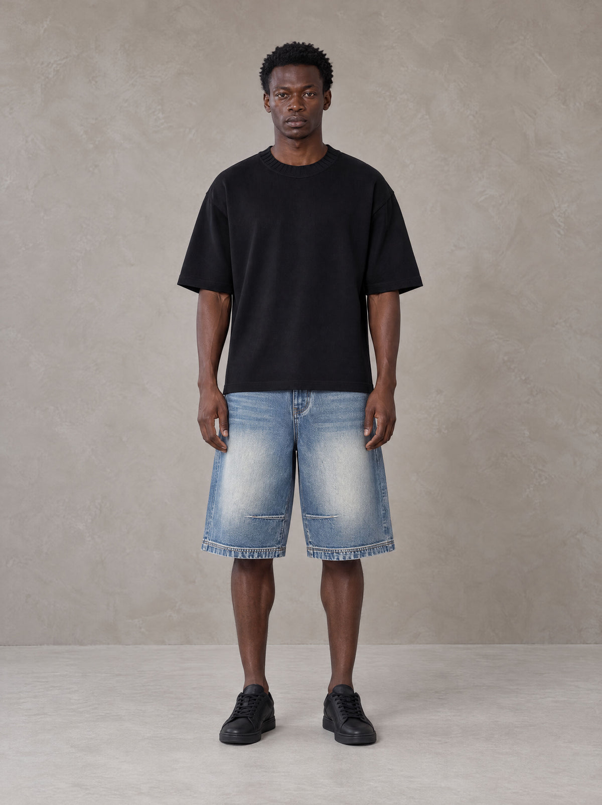 Model wearing SM Heritage Vintage Wash Denim Shorts in Cadet Grey, front view.