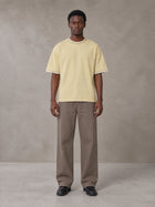 Model wearing SM Sunwash T-shirt in Pavlova, front view.