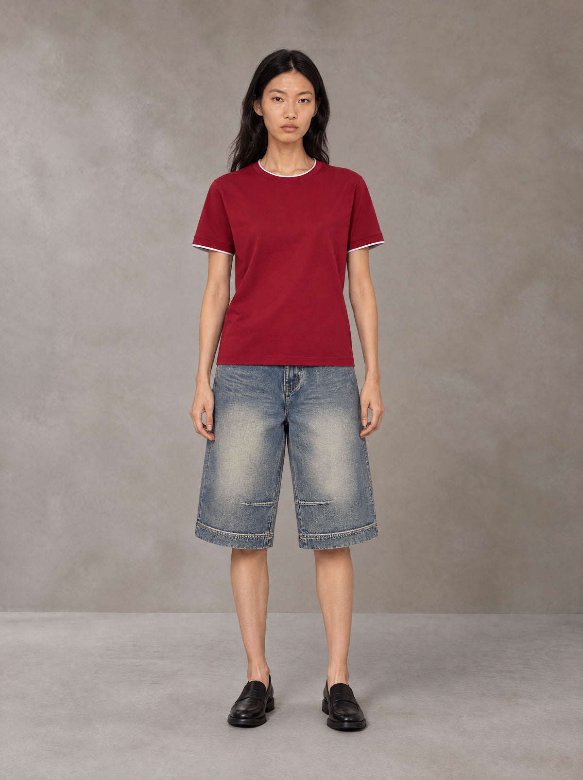 Model wearing SM Sunwash T-shirt in Deep Carmine, front view.