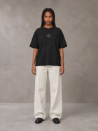 Model wearing SM Still Life NO.01 T-shirt in Midnight Black, front view.