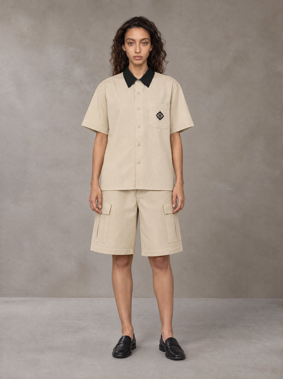 Model wearing SM Eternal Fleur Shirt in Pavlova with SM Eternal Fleur Utility Shorts in Pavlova, front view.