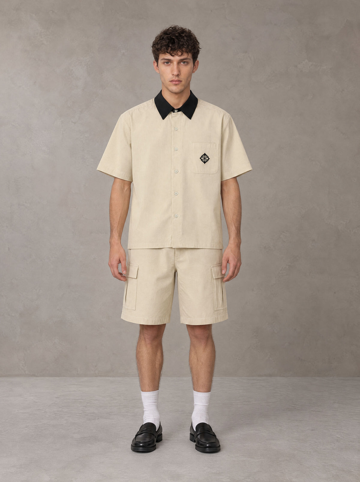 Model wearing SM Eternal Fleur Shirt in Pavlova with SM Eternal Fleur Utility Shorts in Pavlova, front view.