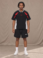 Model wearing SM Motion Vector Jersey in Midnight Black, front view.