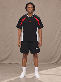 Model wearing SM Motion Vector Jersey in Midnight Black, front view.