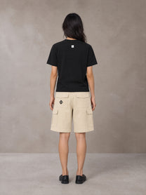 Model wearing SM Sig. Henley T-shirt in Midnight Black, rear view.