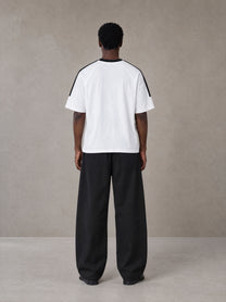 Model wearing SM Sig. Striped T-shirt in Lucent White, rear view.