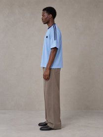 Model wearing SM Sig. Striped T-shirt in Blair Blue, side view.