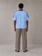 Model wearing SM Sig. Striped T-shirt in Blair Blue, rear view.