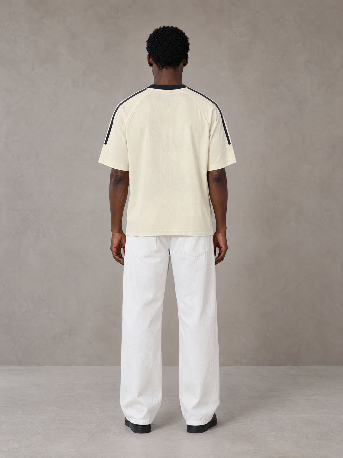 Model wearing SM Sig. Striped T-shirt in Natural Flax, rear view.