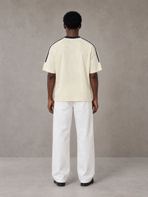 Model wearing SM Sig. Striped T-shirt in Natural Flax, rear view.