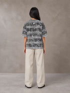 Model wearing SM Sig. Snow Washed Striped T-shirt in Pure Grey, rear view.