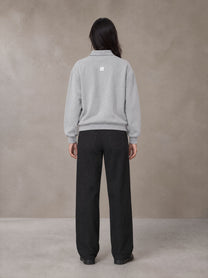 Model wearing SM Sig. Fleece Polo Sweatshirt in Floral Grey, rear view.