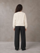Model wearing SM Straight Leg Trousers in Midnight Black, rear view.