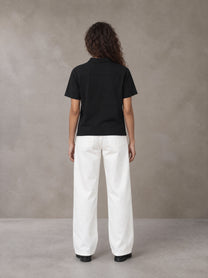 Model wearing SM Straight Leg Trousers in Lucent White, rear view.