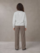 Model wearing SM Straight Leg Trousers in Kabul Brown, rear view.