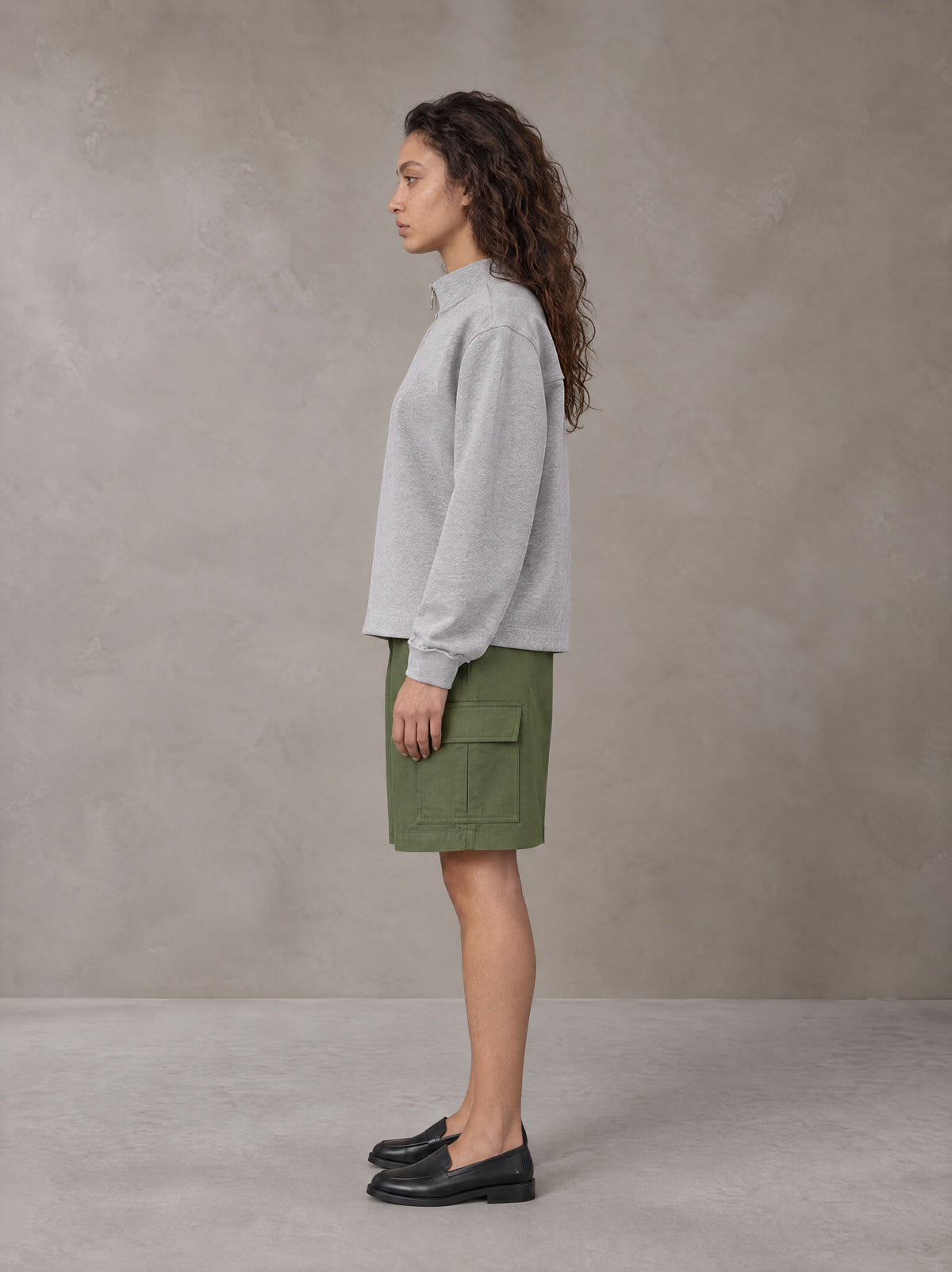 Model wearing SM Sig. Half-Zip Fleece Sweatshirt in Floral Grey, side view.