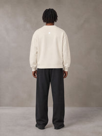 Model wearing SM Sig. Sun Fade Sweatpants in Midnight Black, rear view.