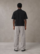 Model wearing SM Snow Fade Sweatpants in Floral Grey, rear view.