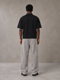 Model wearing SM Snow Fade Sweatpants in Floral Grey, rear view.