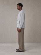 Model wearing SM Sig. Cardigan in Floral Grey, side view.