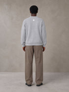 Model wearing SM Sig. Cardigan in Floral Grey, rear view.