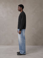 Model wearing SM Sig. Cardigan in Midnight Black, side view.