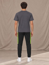 Model wearing SM Motion Stripe Track Trousers in Midnight Black, rear view.