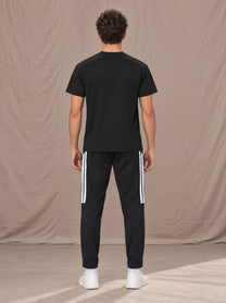 Model wearing SM Motion Stripe Track Trousers in Midnight Black, rear view.