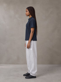 Model wearing SM Sig. Jogger Sweatpants in Floral Grey, side view.