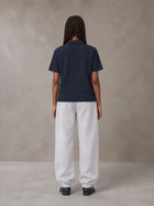 Model wearing SM Sig. Jogger Sweatpants in Floral Grey, rear view.