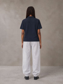 Model wearing SM Sig. Jogger Sweatpants in Floral Grey, rear view.