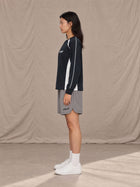 Model wearing SM Motion Sweatshirt in Oxford Navy, side view.