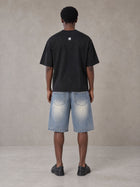 Model wearing SM Heritage Vintage Wash Denim Shorts in Cadet Grey, rear view.
