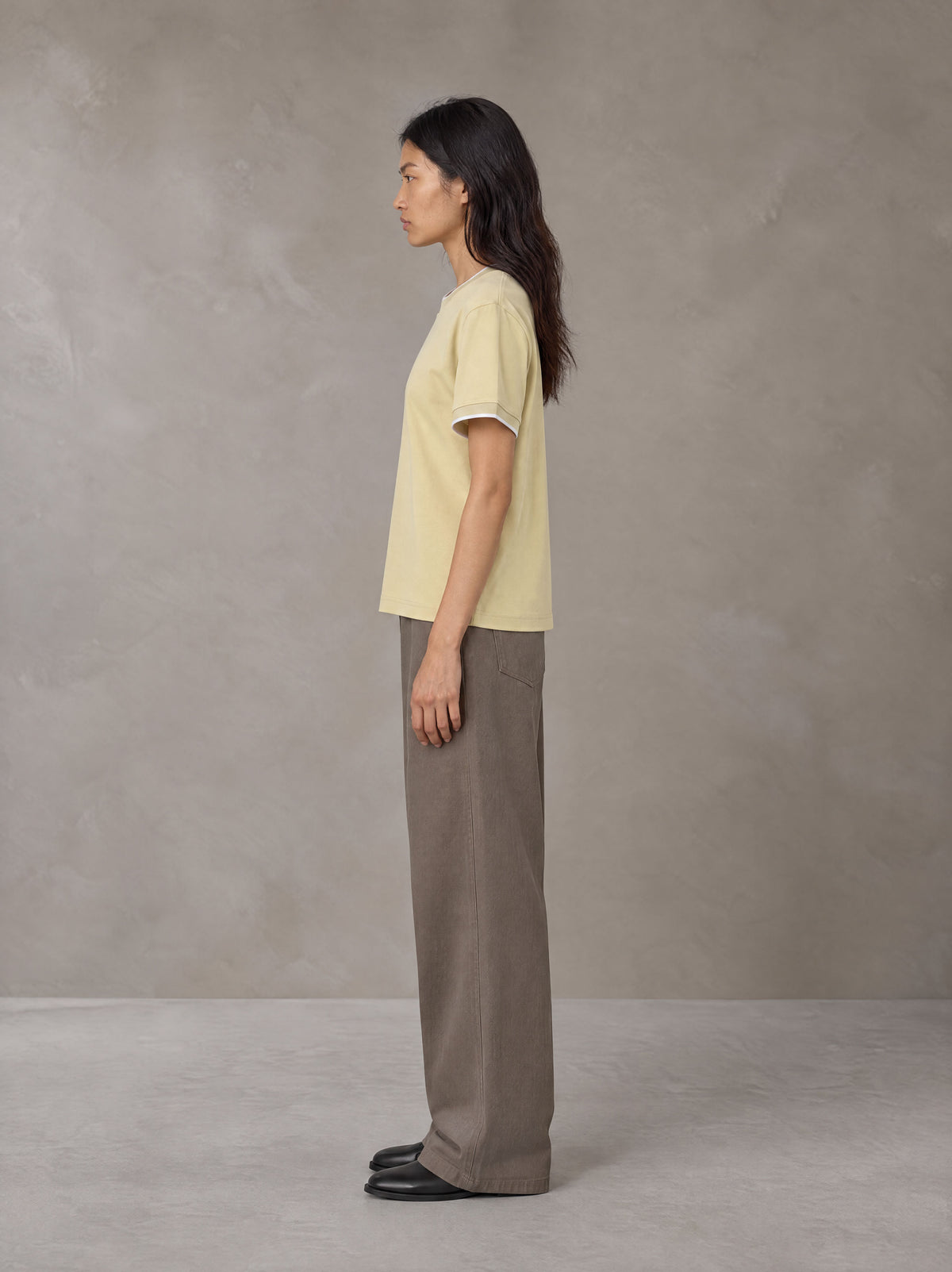 Model wearing SM Sunwash T-shirt in Pavlova, side view.