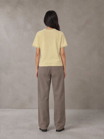 Model wearing SM Sunwash T-shirt in Pavlova, rear view.