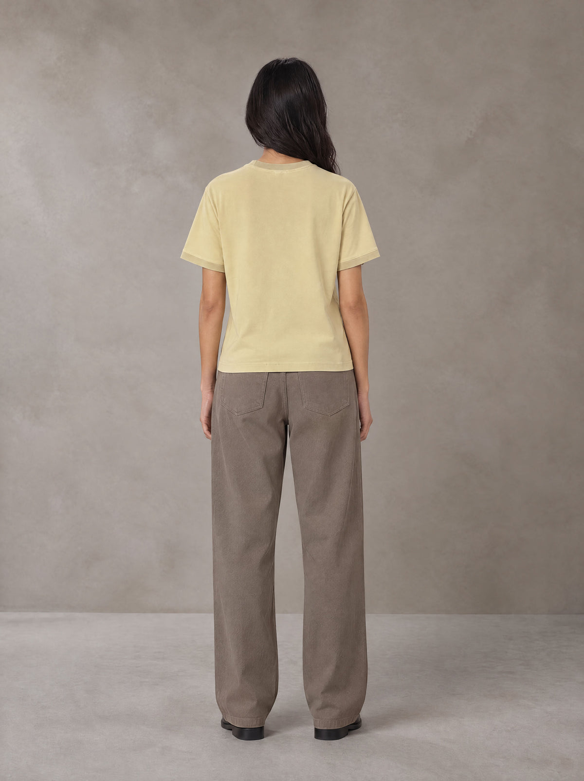 Model wearing SM Sunwash T-shirt in Pavlova, rear view.