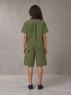 Model wearing SM Eternal Fleur Shirt in Camo Green with SM Eternal Fleur Utility Shorts in Camo Green, rear view.