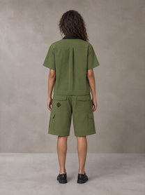 Model wearing SM Eternal Fleur Shirt in Camo Green with SM Eternal Fleur Utility Shorts in Camo Green, rear view.