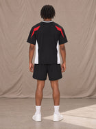 Model wearing SM Motion Vector Jersey in Midnight Black, rear view.