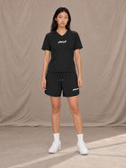 Model wearing SM Motion T-shirt in Midnight Black with SM Motion Oversized Court Shorts in Midnight Black, front view.