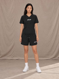 Model wearing SM Motion T-shirt in Midnight Black with SM Motion Oversized Court Shorts in Midnight Black, front view.
